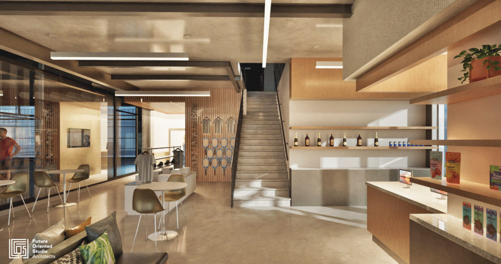 Interior lounge and stairway at Austin Padel Center with modern lighting and displays.